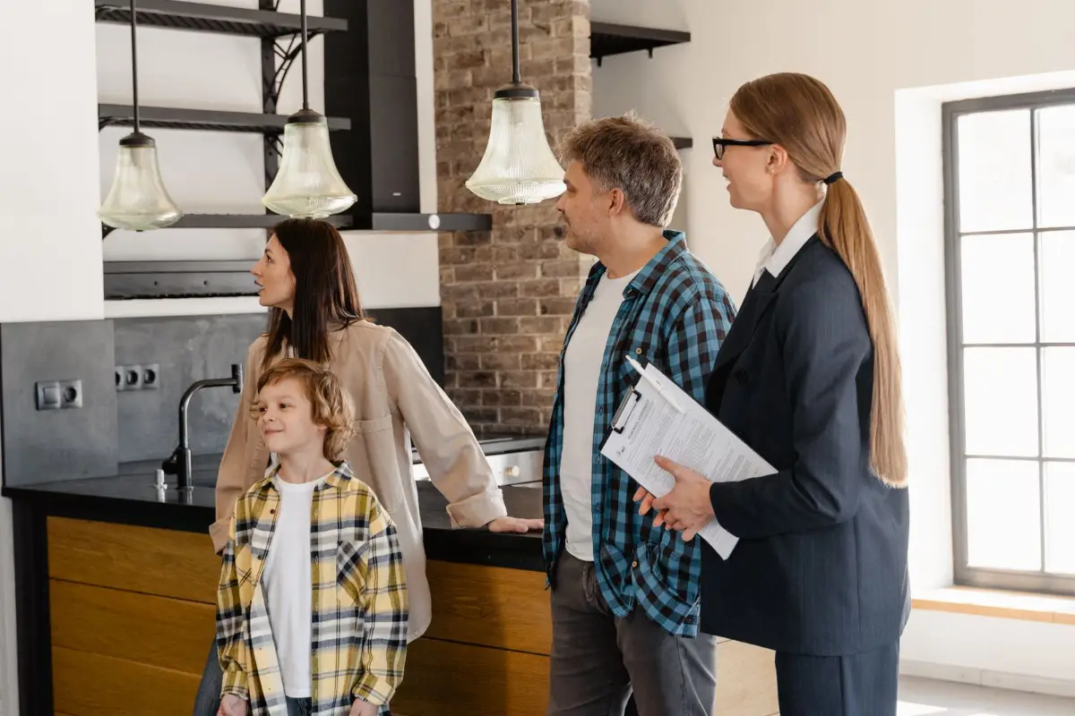 Buyers meeting an agent at a kitchen table