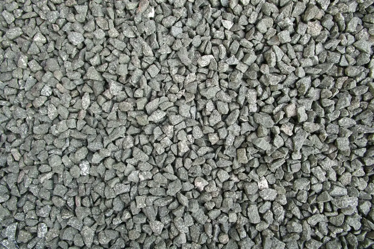 Crushed stone of the kind packed around leach field pipe